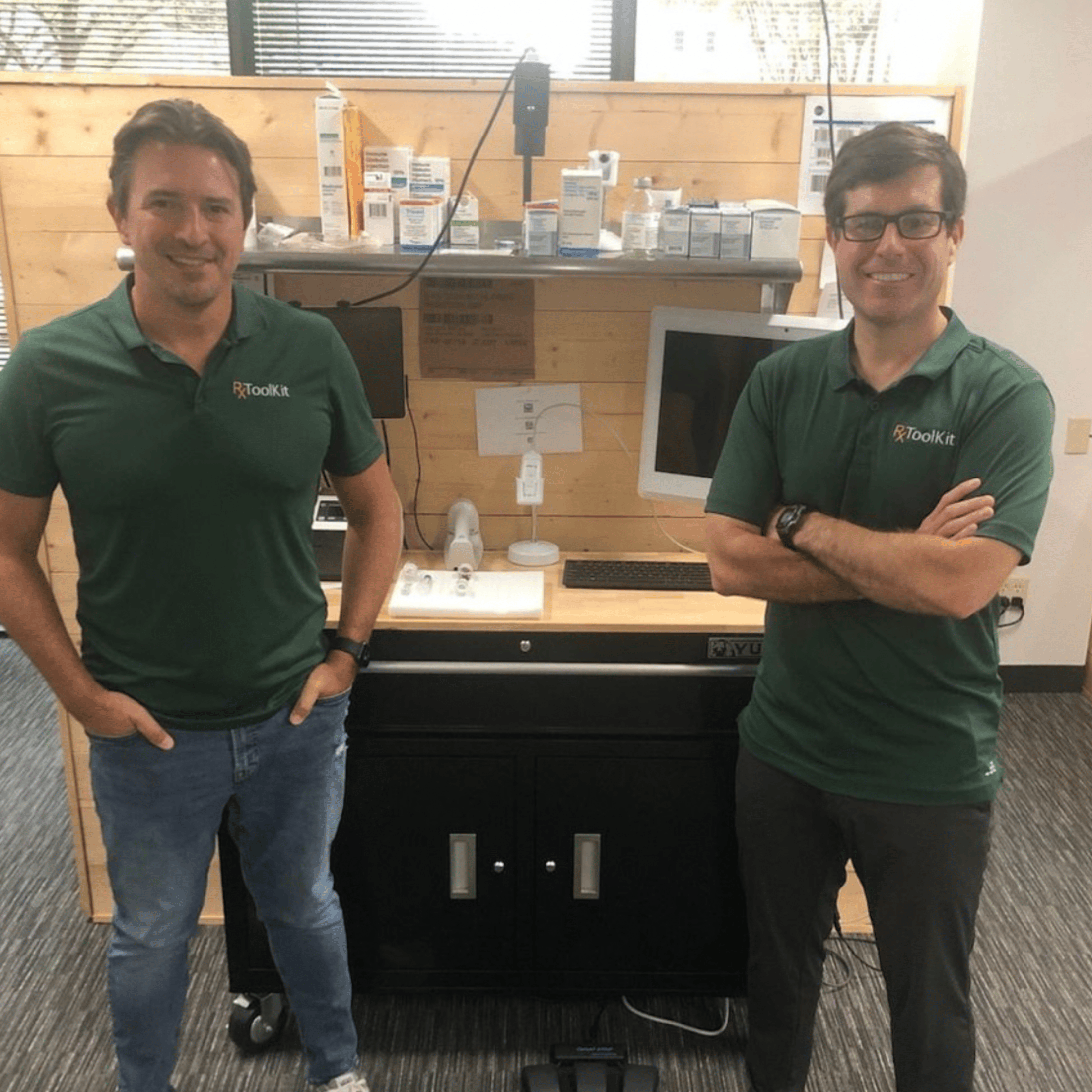 COO Reece and CEO Bryan in the Austin office with RxToolKit shirts on