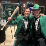 2024 NICA (WeInfuse COO Reece Norris and Ceron Rhee holding WeInfuse's gifted auction item)